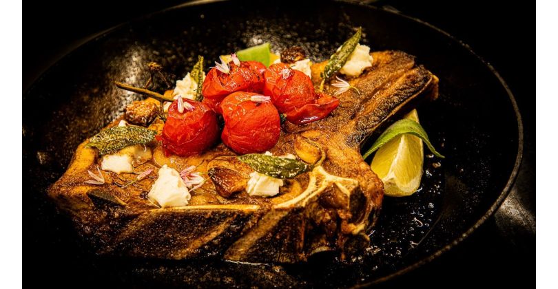 Grilled Sashi or Choco Côte de Boeuf with Caramelized Cherry Tomatoes, Gorgonzola, Garlic, and Sage