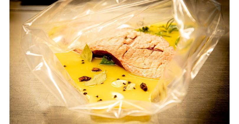 Pink-roasted duck breast with orange sauce in a spicy marinade