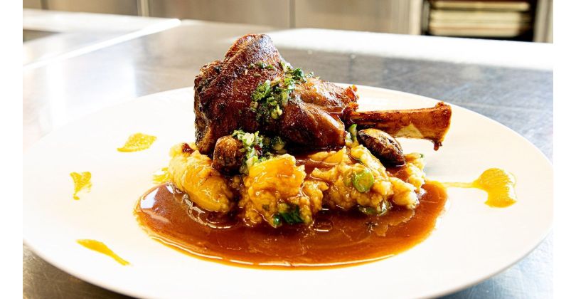 Oven-grilled Lamb Hammer on Mashed Potatoes with Green Asparagus, Jus, and Arugula-Mint Pesto
