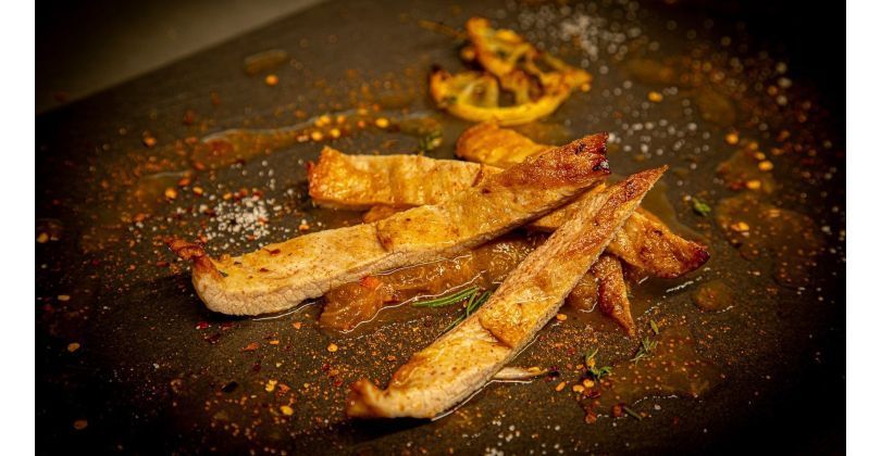 Medium rare grilled Iberico Secreto with fig-chili sauce and mint