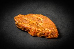 Marinated organic pork neck steak