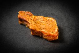 Marinated organic pork bone in steak